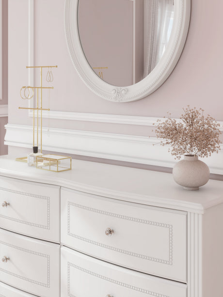 Detail of bun feet and decorative laminate on Kozlani dresser