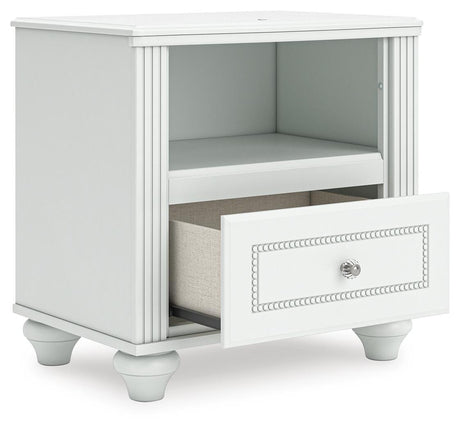 Kozlani White Upholstered Panel Storage Bedroom Set angled view