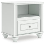 Kozlani White Upholstered Panel Storage Bedroom Set angled view