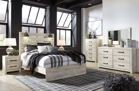 Close-up of dark industrial drawer hardware and whitewash finish