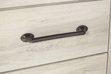 Close-up of wood grain and hardware detail on Cambeck bed