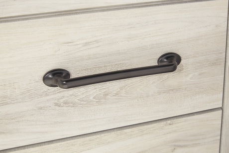 Close-up of wood grain and hardware detail on Cambeck bed