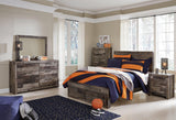 Derekson Full Panel Bed displayed in bedroom setting