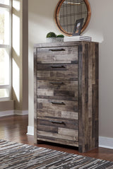 Close-up of metal drawer pulls on Derekson Multi Gray Chest