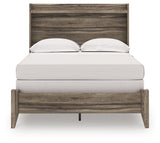 Back view of Elbrim full panel bed in weathered brown finish