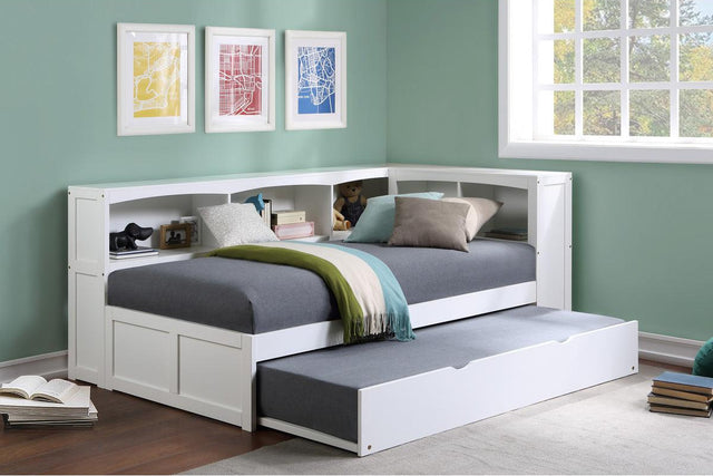 Youth bedroom setup featuring Galen White Twin Bookcase Corner Bed with Twin Trundle