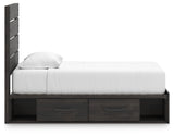 Bed fully assembled with bedding on Hollivern twin bed