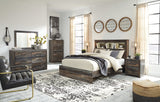 Close-up of Drystan bed's replicated wood grain with burnt orange and teal accents
