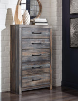Drystan Multi Chest of Drawers angled front view with burnt orange and teal accents