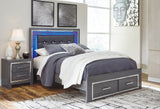 Side view of Lodanna Queen Panel Bed showing LED lighting