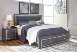 Styled bedroom scene with Lodanna Gray King Panel Bed and LED lights on