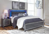 Close-up of Lodanna bed button-tufted faux leather headboard