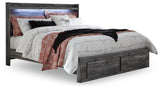 Baystorm gray king panel bed side angle showing panel details and storage drawers