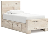 Open drawer detail of Lawroy twin bed showing faux linen laminate interior