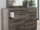 Close-up detail of drawer handle and weathered gray finish