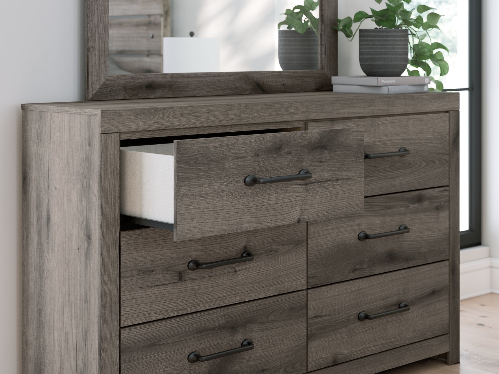 Close-up detail of drawer handle and weathered gray finish