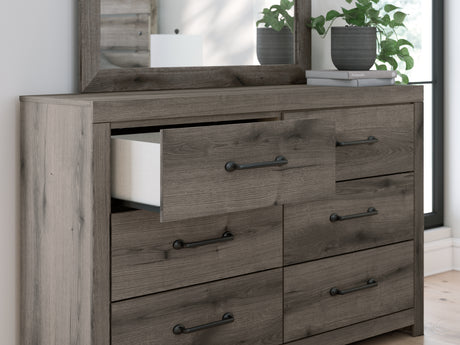 Close-up detail of drawer handle and weathered gray finish