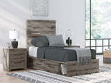 Side view of Graystorm Twin Panel Bed with drawers open