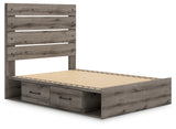 Close-up of bed footboard with laminate replicating oak grain