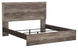 Ralinksi Gray King Panel Bed side view with headboard