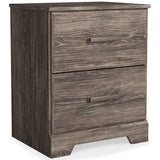 Ralinksi Gray Nightstand closed drawers side angle