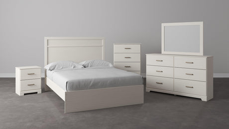 Angled side view of Stelsie White Dresser showing drawers and mirror
