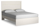 Close-up of Stelsie White Queen Panel Bed headboard with plank style molding