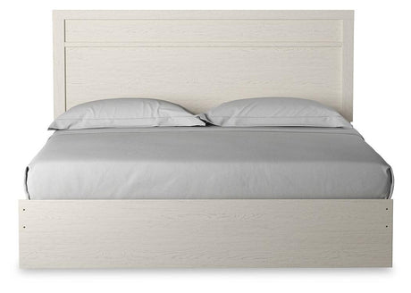 Stelsie White King Panel Bed - head-on view showcasing plank-style molding headboard