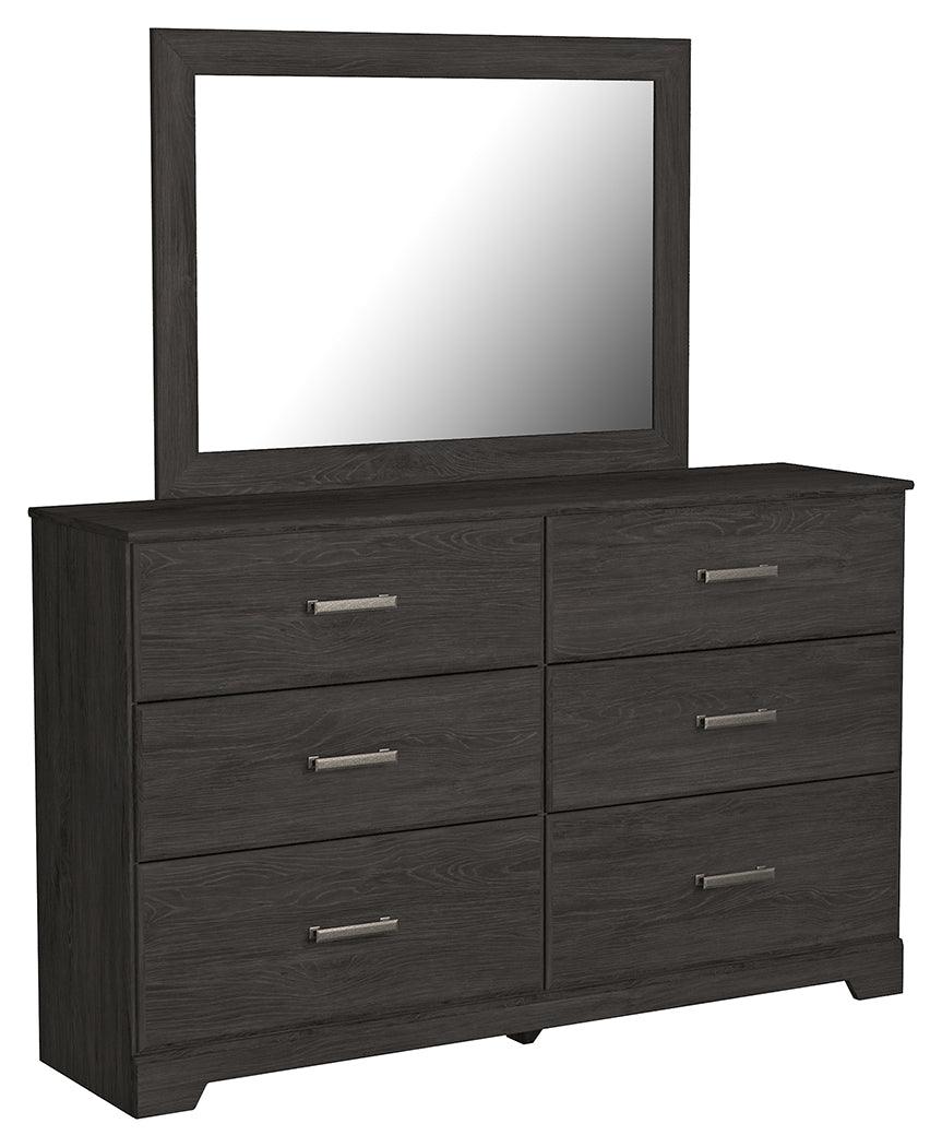 Side angled view of folded dresser drawers in Belachime Black set