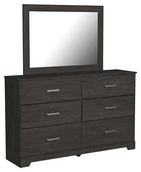 Side angled view of folded dresser drawers in Belachime Black set