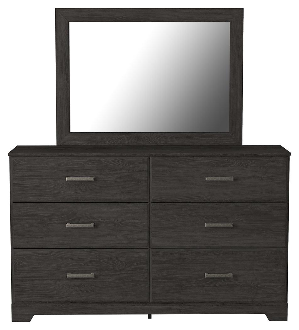 Head-on view of Belachime Black dresser and mirror set showing drawer fronts