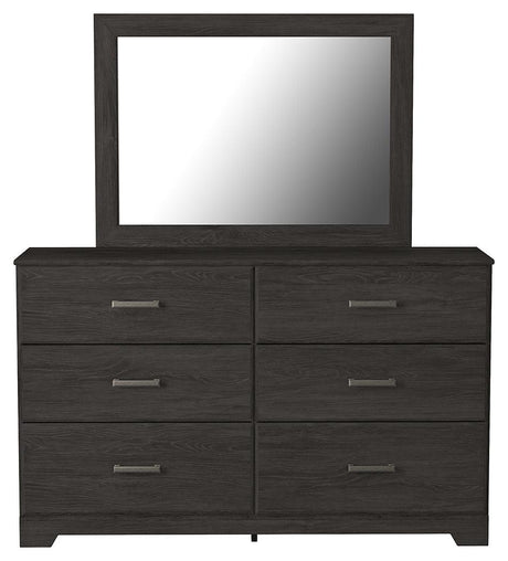 Head-on view of Belachime Black dresser and mirror set showing drawer fronts