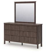 Close-up of black drawer pulls on Pamytta dresser