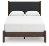 Head-on view of Pamytta Queen upholstered panel bed