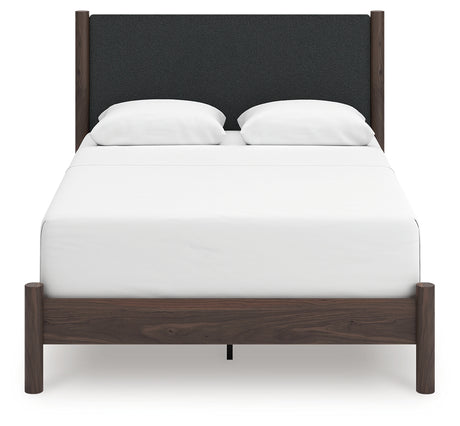 Head-on view of Pamytta Queen upholstered panel bed