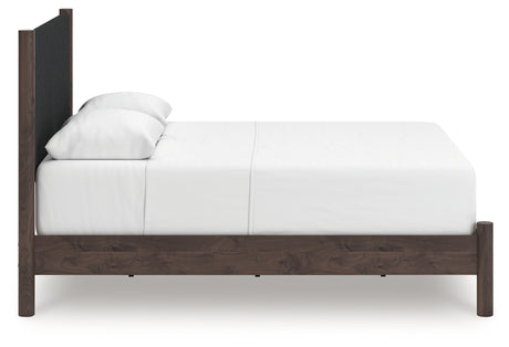 Side view of Pamytta brown panel bed