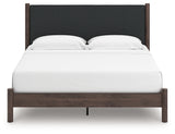 Front view of upholstered panel headboard on king bed