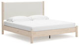 Side angle of Cadmori two-tone king upholstered panel bed