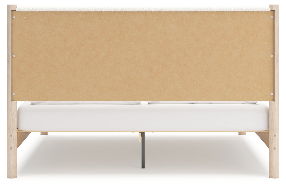 Back view of Cadmori two-tone king upholstered panel bed