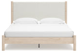 Head-on view of Cadmori king upholstered panel bed