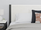 Headboard close-up showing fabric and panel details