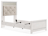 Altyra White Queen Panel Bed headboard close-up showing upholstery and glitter accents