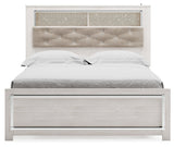 Head-on view of Altyra White Queen Panel Bookcase Bed showcasing button-tufted upholstery and bookcase shelves