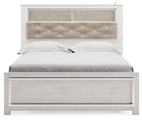 Head-on view of Altyra White Queen Panel Bookcase Bed showcasing button-tufted upholstery and bookcase shelves