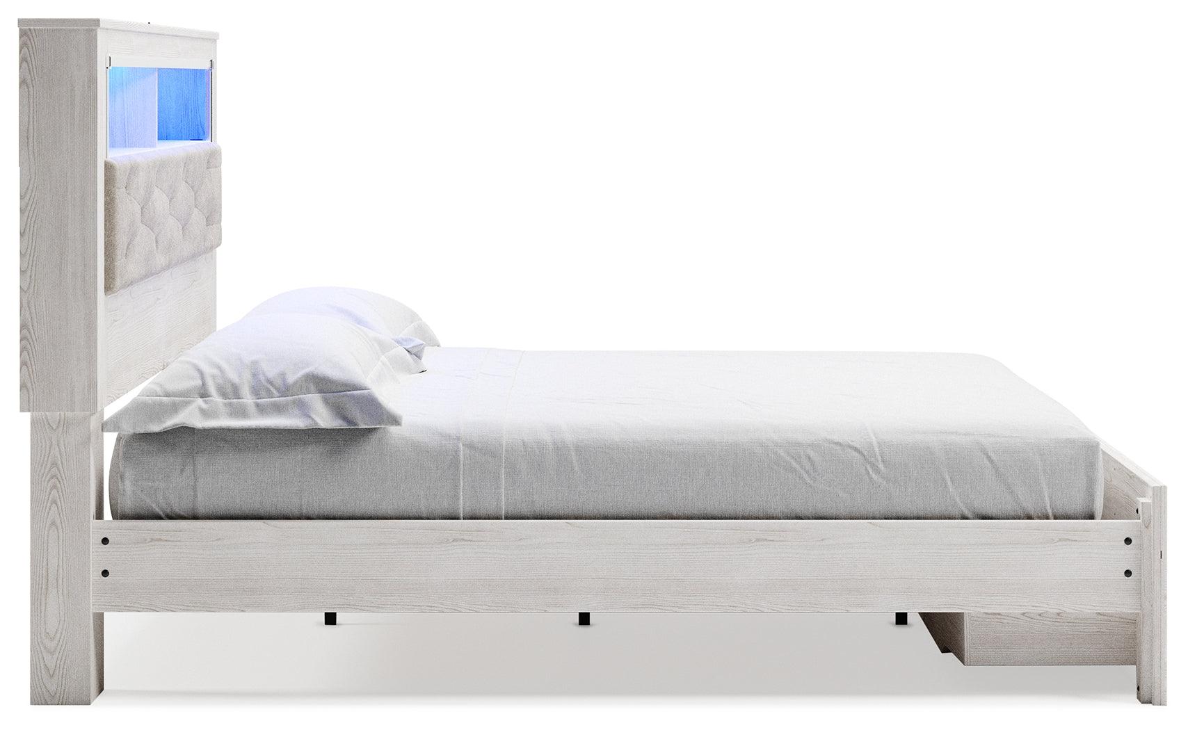 Altyra White King Upholstered Bookcase Bed with Storage - footboard drawers detail