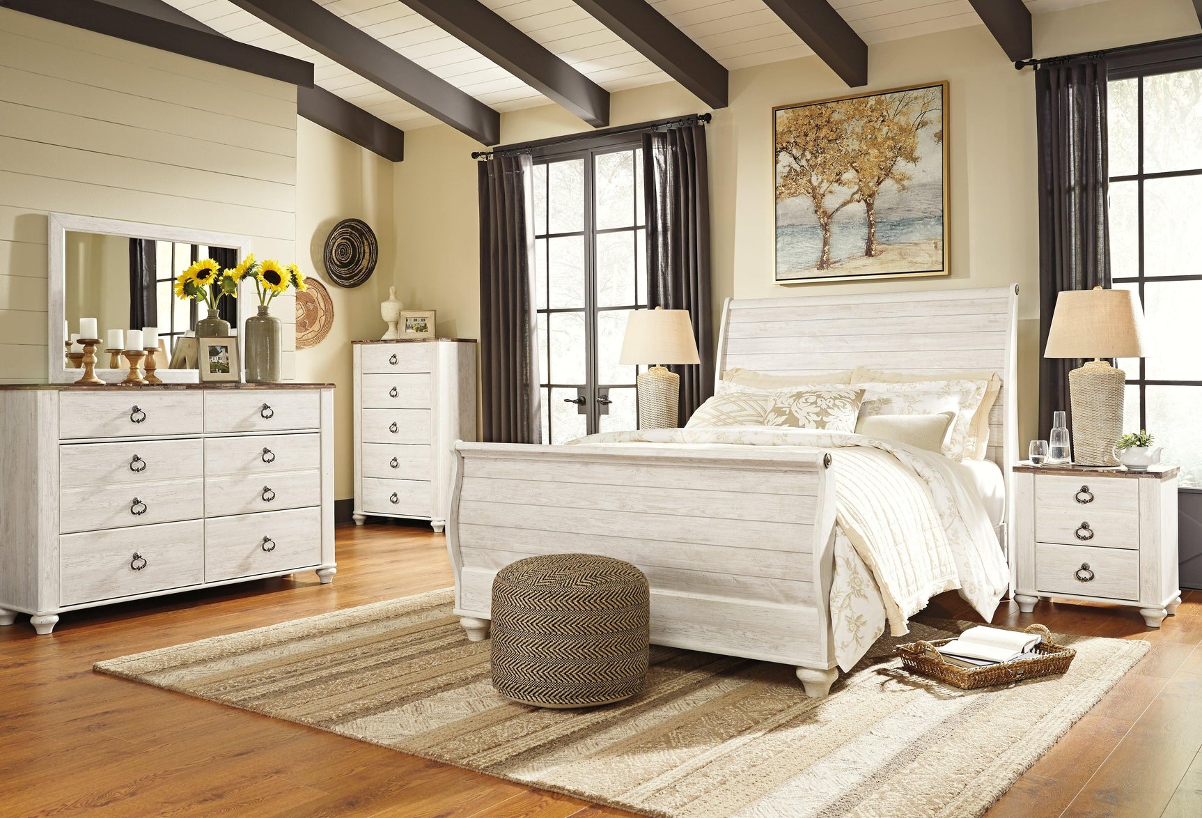 Willowton Whitewash Queen Sleigh Bed angled with natural light