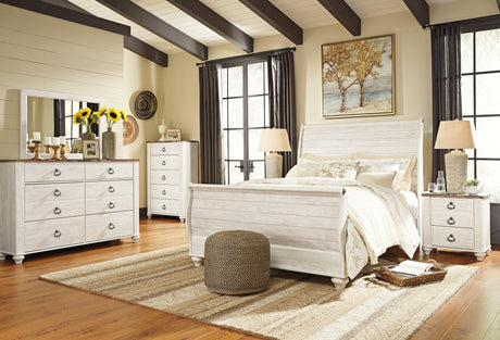 Willowton Whitewash Queen Sleigh Bed angled with natural light