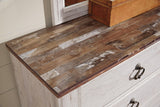 Detail of whitewash finish on Willowton nightstand drawer