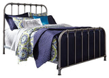 Nashburg Black Queen Metal Bed styled in bedroom