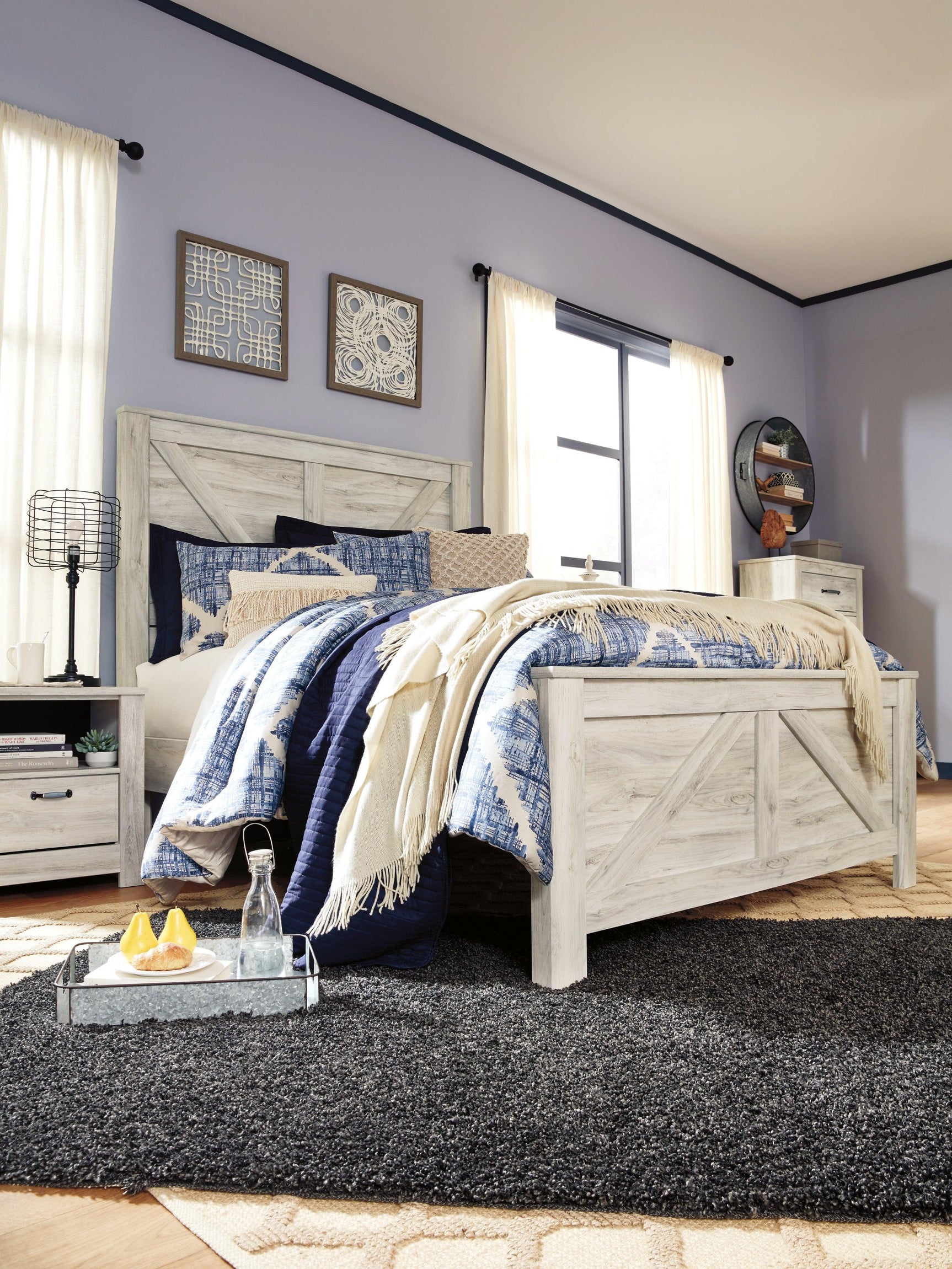 Bellaby Whitewash Queen Crossbuck Panel Bed styled in bedroom